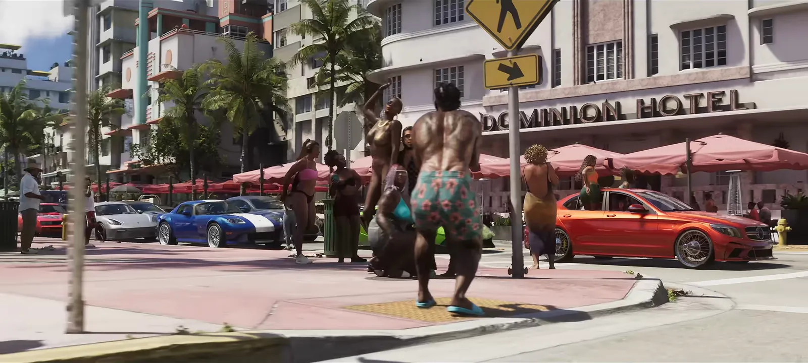 Dominion Hotel in GTA VI: Tourists pose on the corner outside the Dominion Hotel as sports cars line the street.