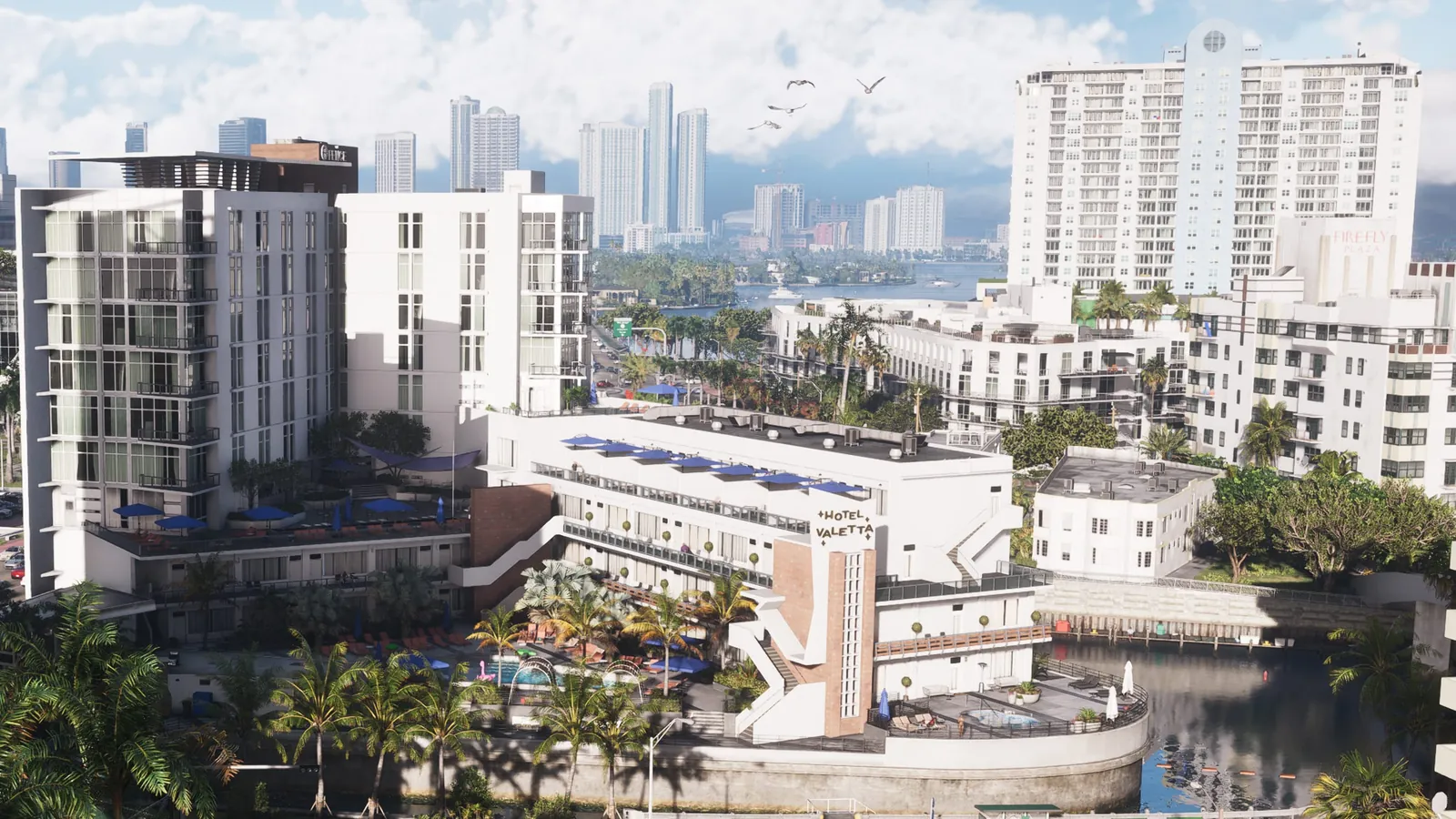 The Fence in GTA VI: Hotel Valetta and its neighboring white hotel block on a Vice Beach canal, with the Firefly Plaza tower behind.