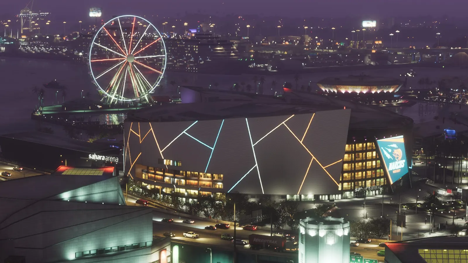 Sahara Arena in GTA VI: Sahara Arena at night, its angular facade lit with neon lines and a Narcos banner, the Ferris wheel on the bay behind.