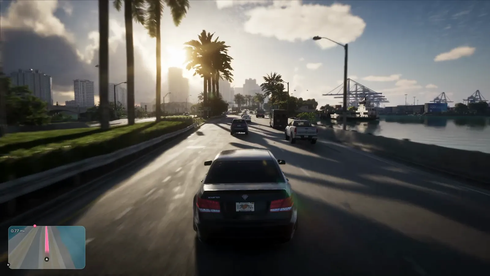 MacArthur Causeway in GTA VI: A palm-lined causeway into Vice Beach running alongside the channel, with the container port's cranes across the water.