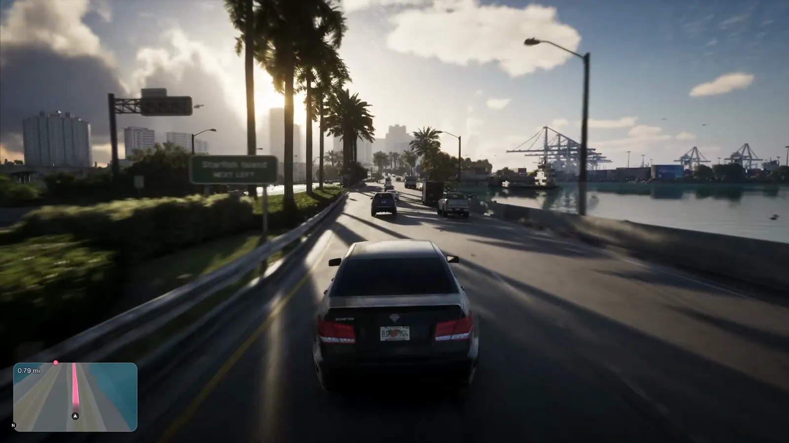 Starfish Island in GTA VI: Driving the causeway past a 'Starfish Island – Next Left' sign, with port cranes across the channel.