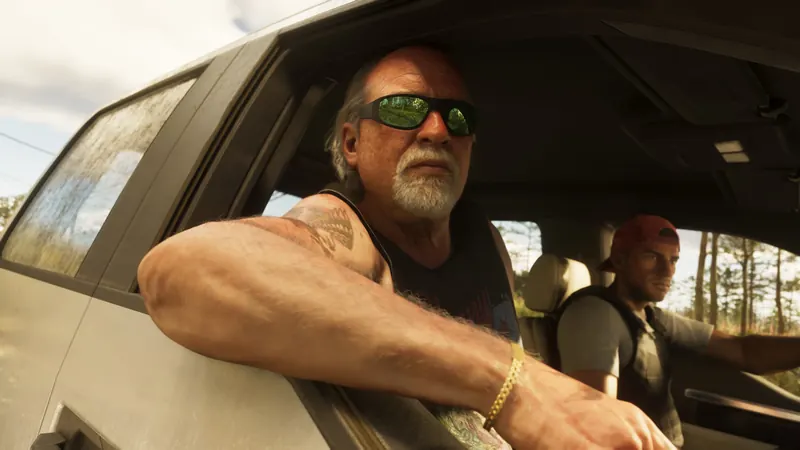 Brian Heder driving a pickup, arm out the window.